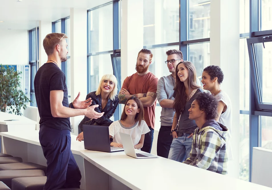 Team collaboration in a modern office setting, available at Elevate Your Organization's Culture and Performance With CEEK.