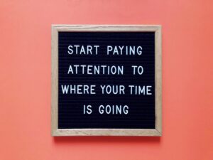 Start paying attention to where your time is going sign on orange background, available at Elevate Your Organization's Culture and Performance With CEEK.