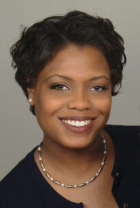 Smiling professional woman representing leadership, only available at Elevate Your Organization's Culture and Performance With CEEK.