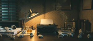 Vintage film noir office desk with old typewriter, whiskey glass, and crumpled papers, only at Elevate Your Organization's Culture and Performance With CEEK.