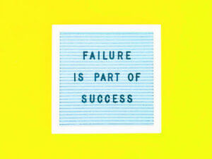 Failure is part of success message on blue board, exclusively at Elevate Your Organization's Culture and Performance With CEEK.