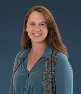 Professional woman smiling, representing leadership and culture transformation, featured at Elevate Your Organization's Culture and Performance With CEEK.